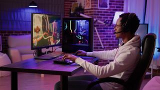a gamer playing on a full gaming setup