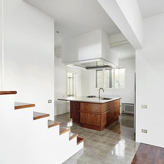 Room with wooden countertop and staircase
