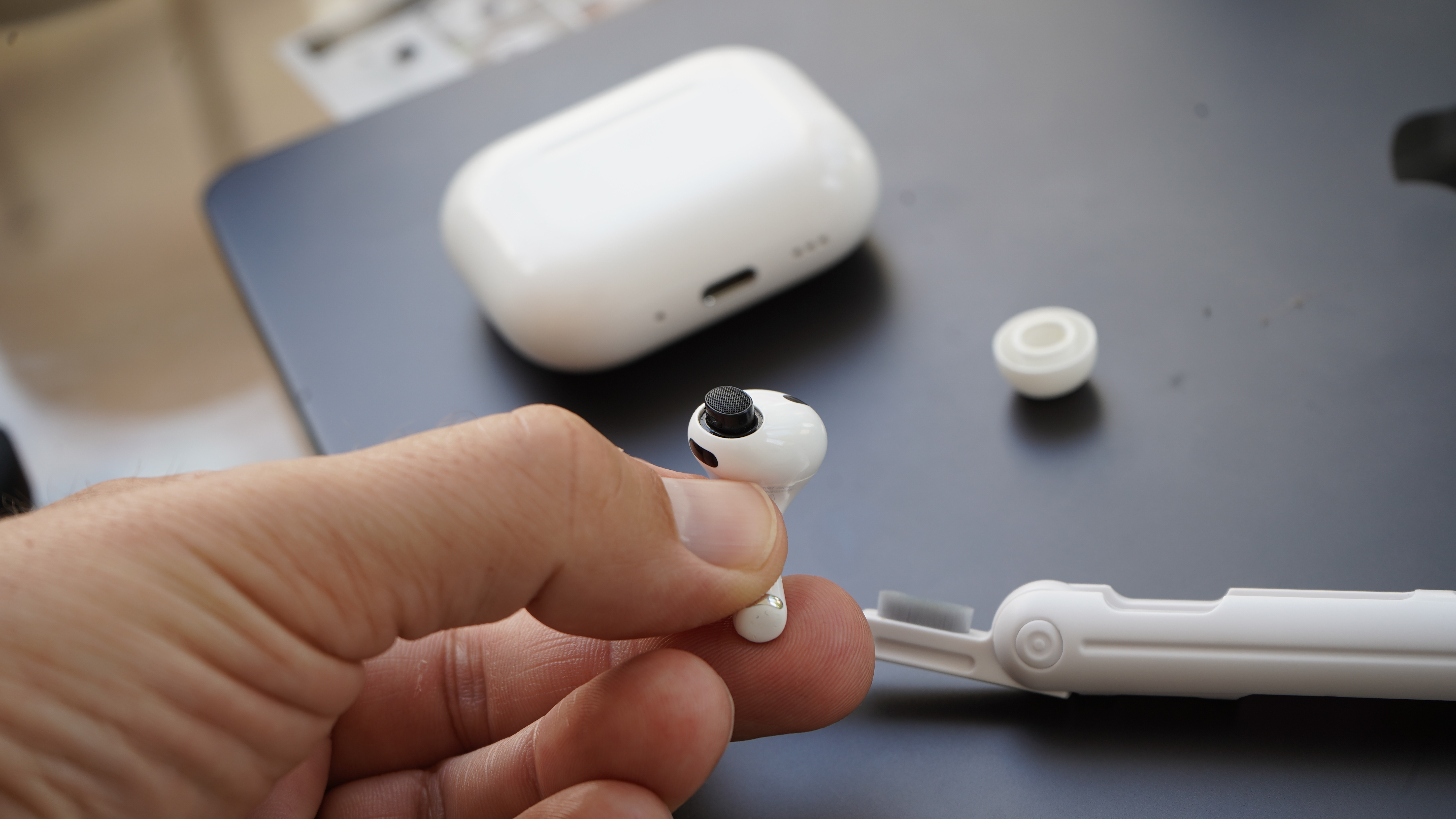 AirPod Pro with brush Tool behind