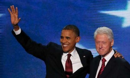 President Barack Obama joins former President Bill Clinton onstage after the 43rd president's address at the DNC on Wednesday night. On Thursday, Obama will take the stage to deliver a speech