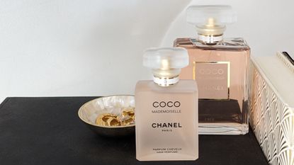 Hand holding Chanel Coco Mademoiselle Fragrance