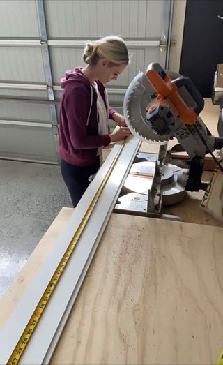 Cutting shiplap wood panels with saw