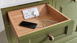 how to organize a kitchen with mutlipurpose drawers that serve as charging stations