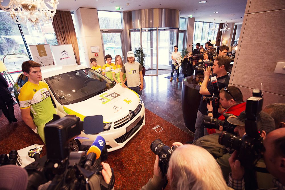 Peter Sagan stands with Cys Zilina riders in front of the new team car.
