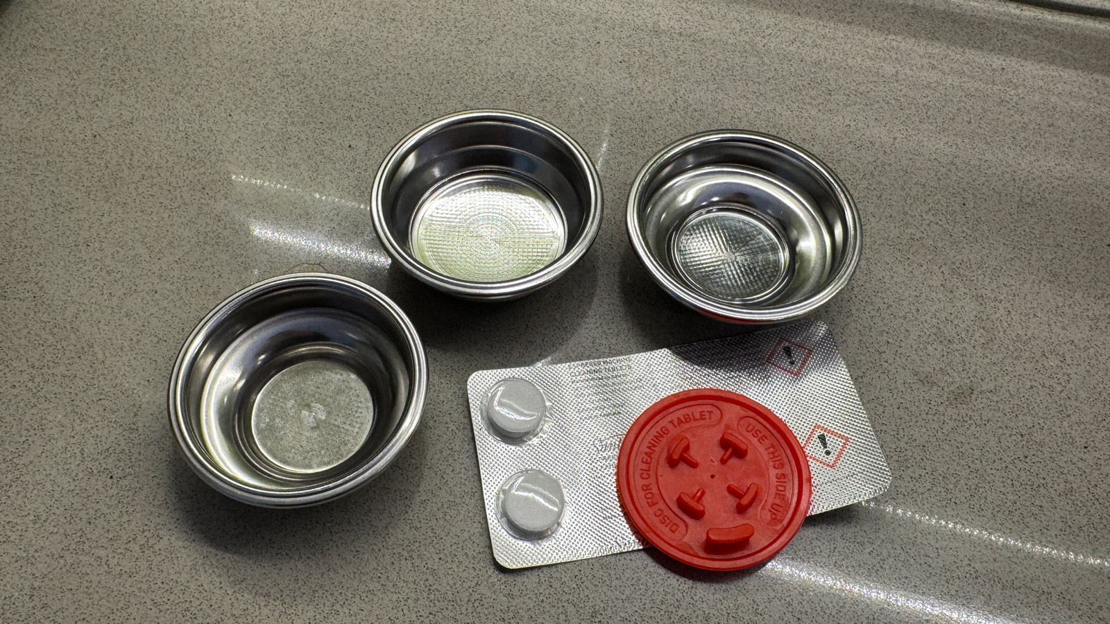 Filter baskets and cleaning accessories supplied with the Sunbeam Origins Sense