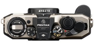 The top of the Pentax 17 half-frame film camera in black and silver.