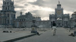 Napoleon VFX; man on horse riding towards large building