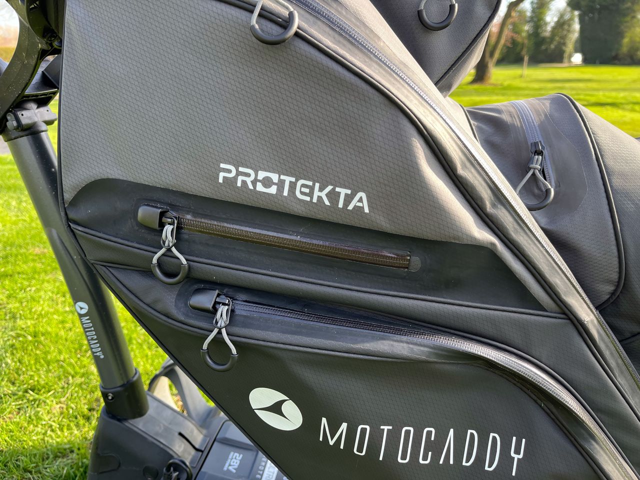A detailed view of the valuables pocket on the Motocaddy Protekta cart bag