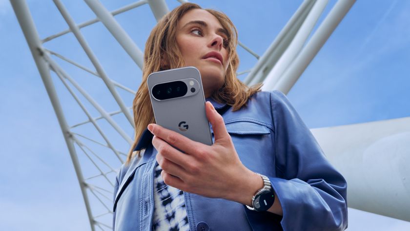 A woman holding the Pixel 10 Pro