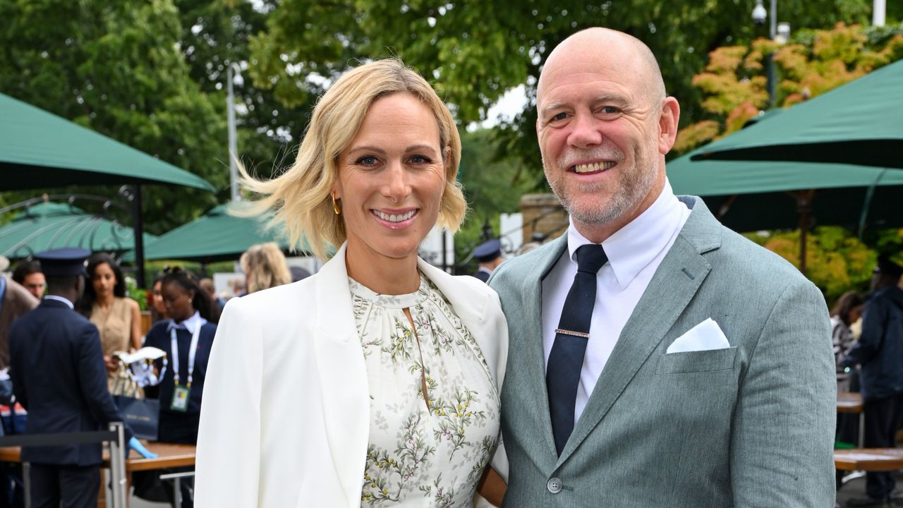 Zara Tindall, wearing a white blazer and floral dress, and Mike Tindall, wearing a suit, attend day ten of the Wimbledon Tennis Championships 2024