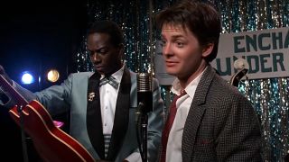 Michael J Fox explains himself on the microphone in Back To The Future.