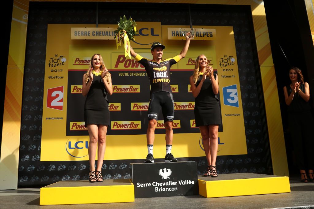 Primoz Roglic on the podium after winning stage 17 of the Tour de France