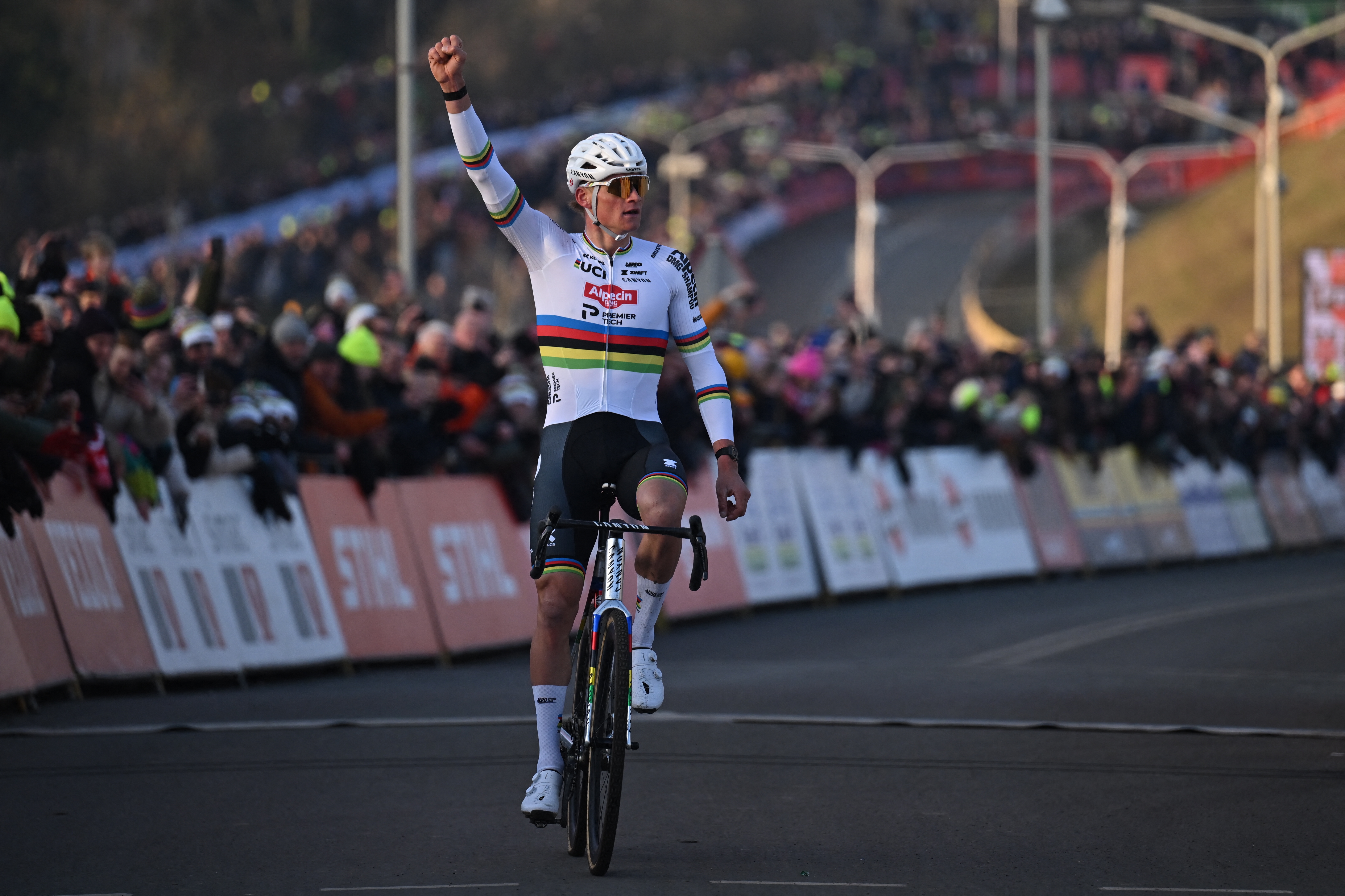 Dutch Mathieu Van Der Poel celebrates as he crosses the finish line to win the men's elite race at the World Cup cyclocross cycling event in Hoogerheide, Netherlands, stage 12 (out of 12) of the UCI World Cup cyclocross competition, Sunday 25 January 2026.BELGA PHOTO LUC CLAESSEN (Photo by LUC CLAESSEN / BELGA MAG / Belga / AFP via Getty Images)
