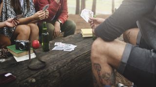 Group of Friends Hanging Playing Cards Together Concept