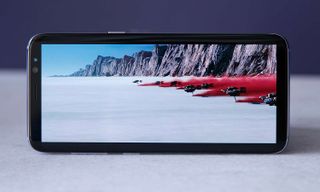 On a 16:9 display, there would be even bigger black bars across the top and bottom of the screen.