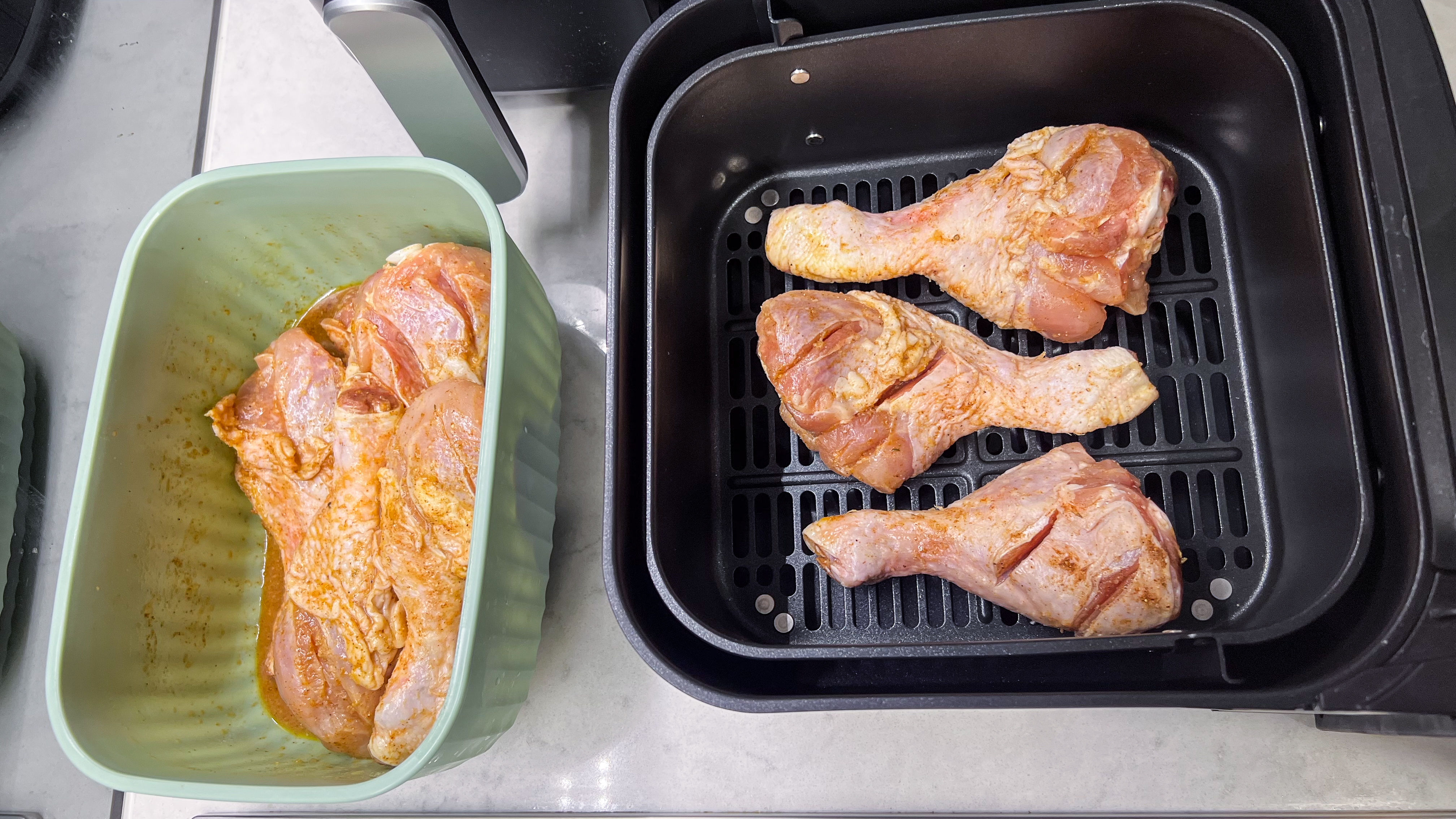 Chicken drumsticks in the large drawer of the Philips 5000 Series Dual Basket Air Fryer XXL Steam