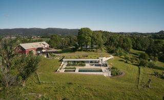 Aerial overview of Villa AA by CF Moller into the green landscape