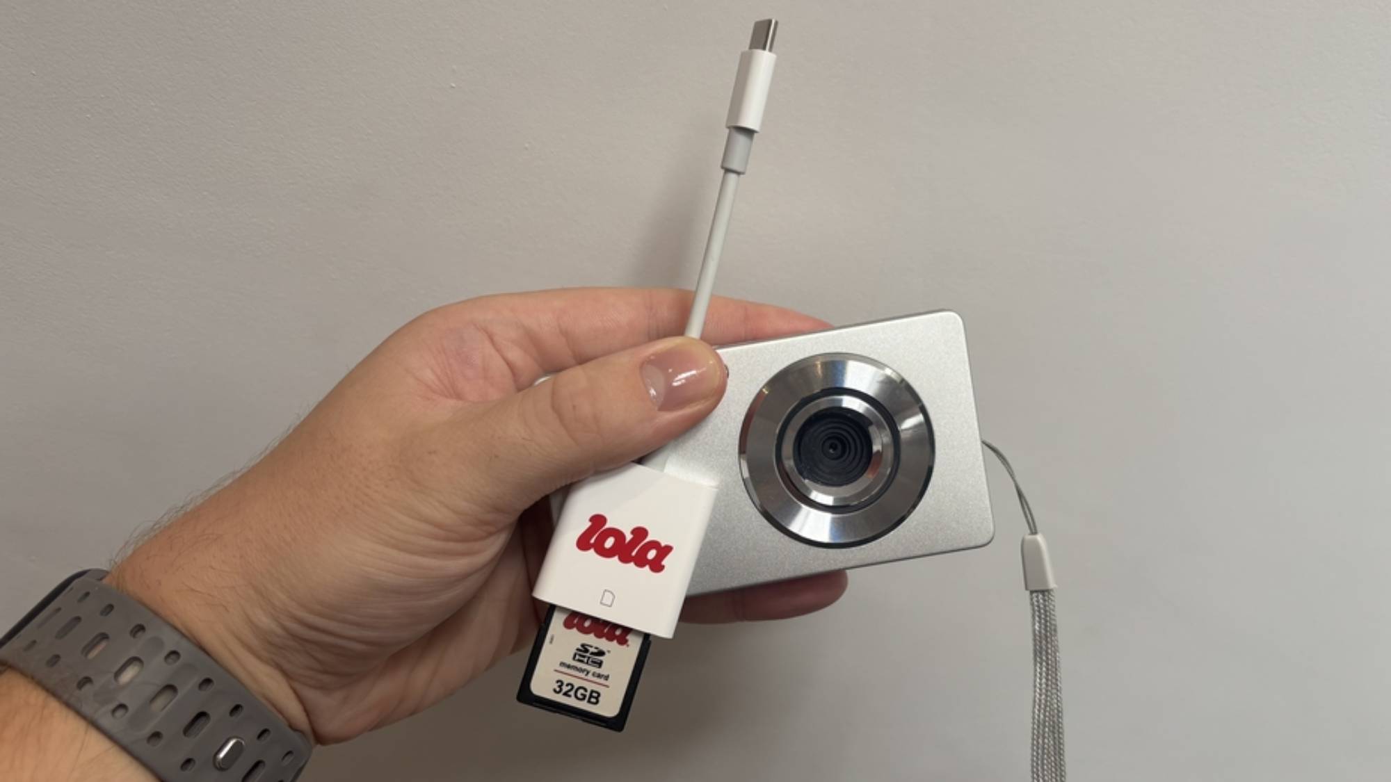 The Lola digital camera with the SD card adapter for smartphone importing