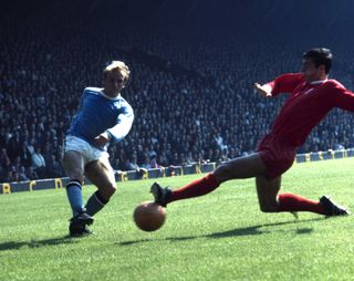 Manchester City's Francis Lee has a shot blocked by Liverpool's Ron Yeats in a game in August 1968.