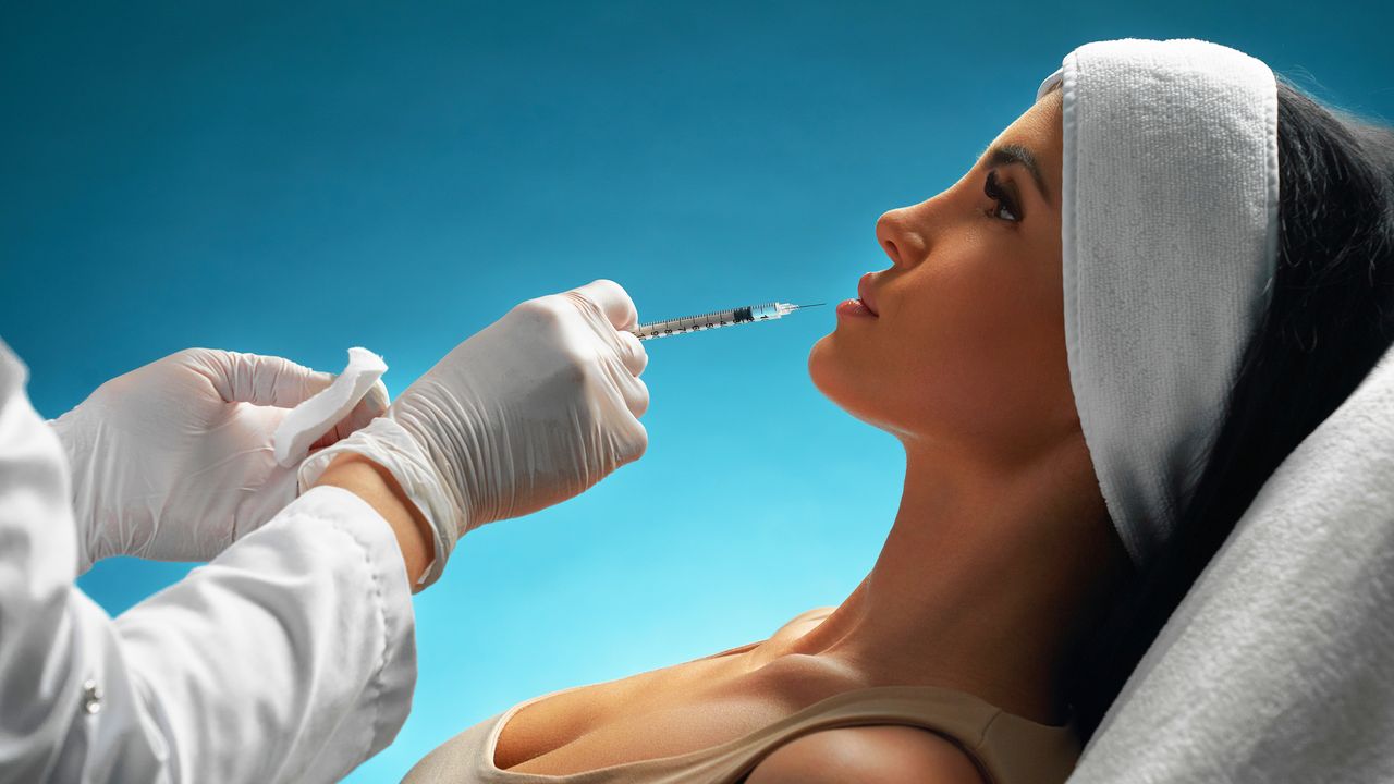 woman getting a filler removed