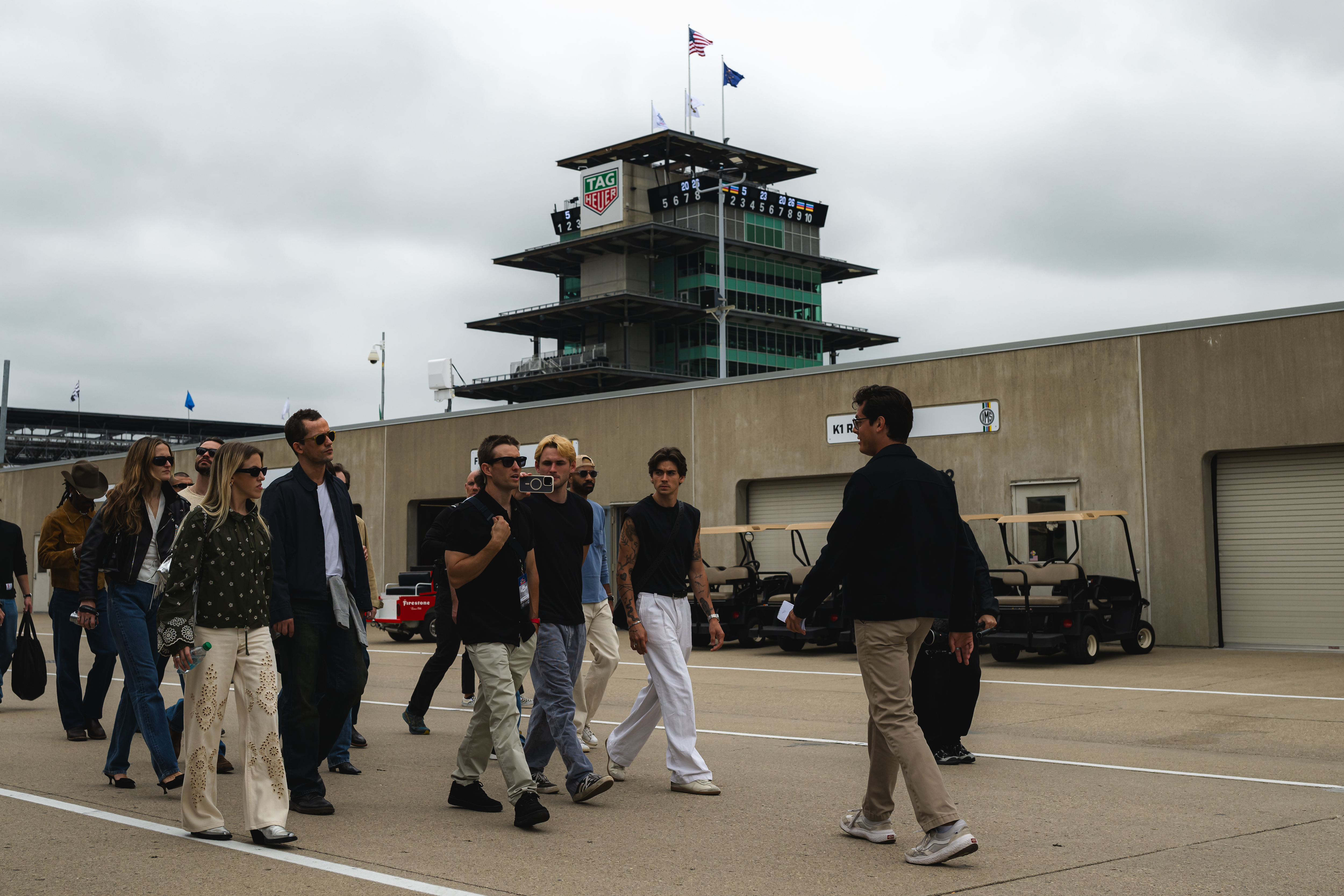A photo of the group of talent and editors getting a tour on fan day before the Indy 500.