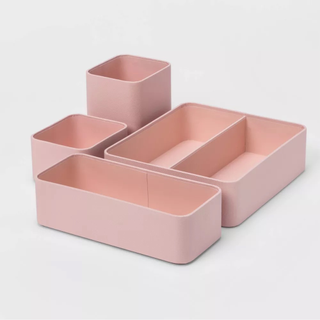 A muted pink 4-piece organizer set