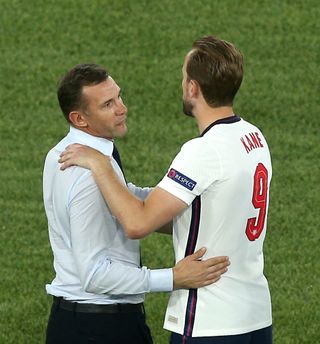 Harry Kane is congratulated by Andriy Shevchenko, left, after the final whistle