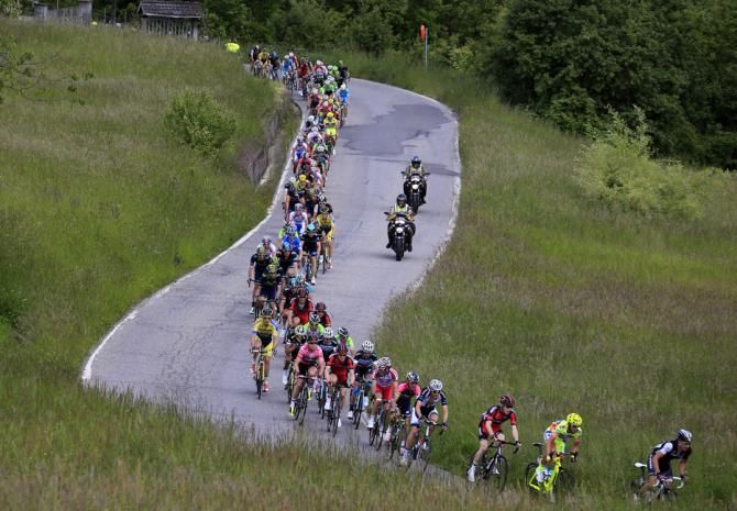 The peloton sweep through the Italian countryside