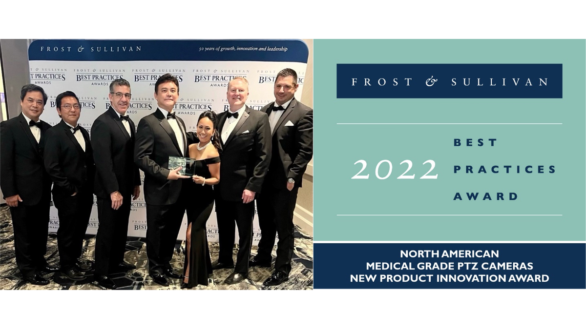 A group of AVer employees smiling and dressed to the nines while accepting the Frost &amp; Sullivan 2022 Best Practices Award.