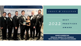 A group of AVer employees smiling and dressed to the nines while accepting the Frost & Sullivan 2022 Best Practices Award.