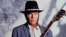neil young on a gray background in the '80s
