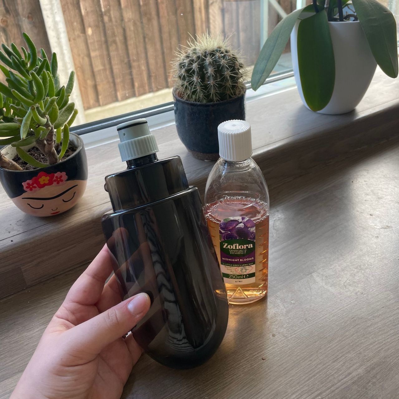 Minky Spritz &amp; Spin Spray Mop bottle next to a bottle of zoflora