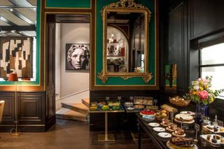 A jade green breakfast room at Hotel Vilon