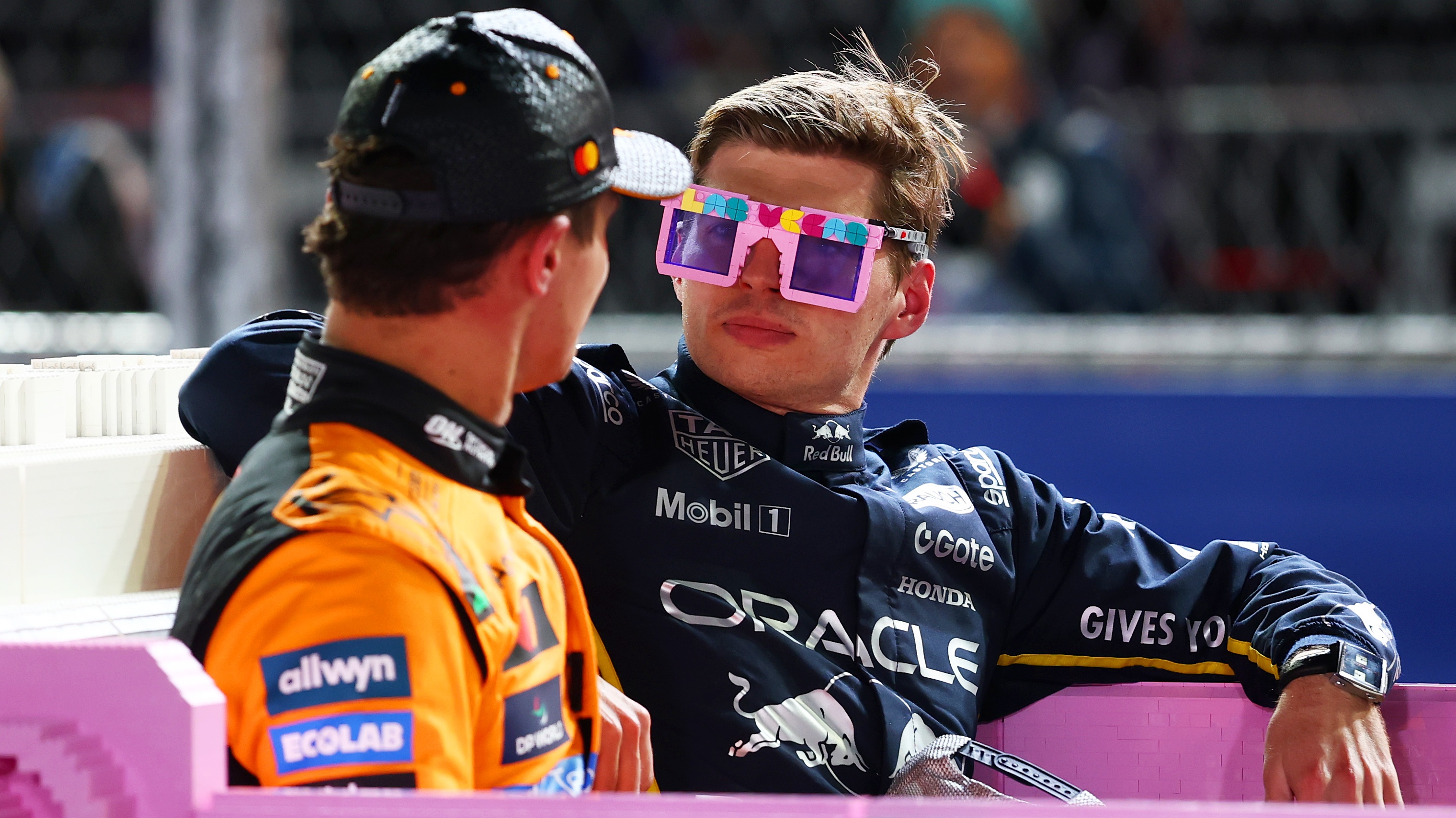 Race winner Max Verstappen of the Netherlands and Oracle Red Bull Racing and Second placed Lando Norris of Great Britain and McLaren (later disqualified) in a Lego pink Cadillac in parc ferme during the F1 Grand Prix of Las Vegas at Las Vegas Strip Circuit on November 22, 2025 in Las Vegas, Nevada. McLaren drivers Lando Norris and Oscar Piastri were both later disqualified from the Las Vegas Grand Prix result after post-race checks found their cars did not to comply with technical regulations.
