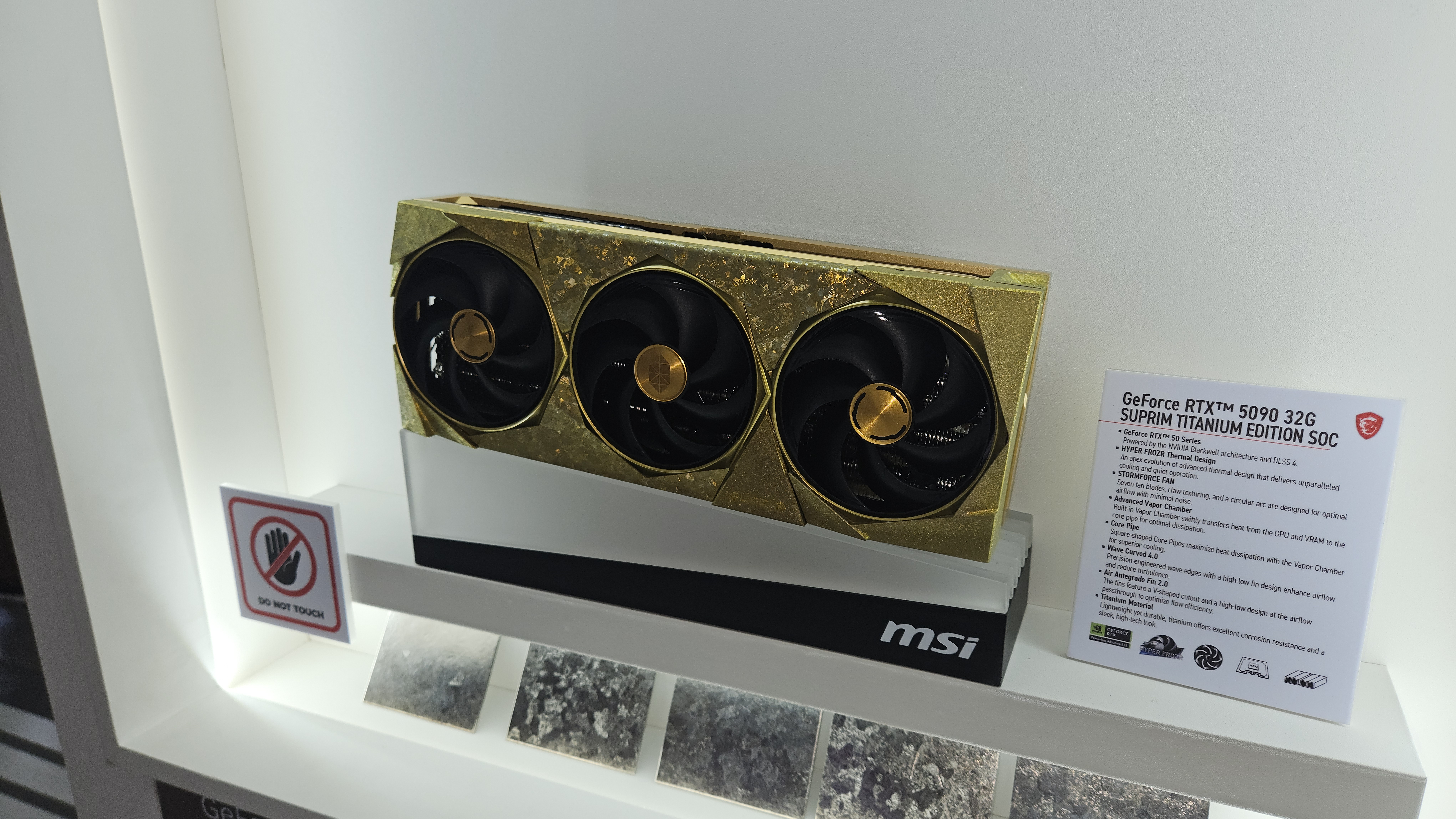 An MSI GeForce RTX 5090 Suprim Titanium Edition graphics card at Computex 2025
