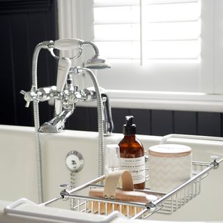 bathroom with white window sink and water faucet