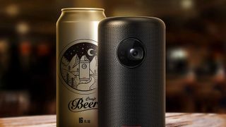 Anker Nebula II Mini outdoor projector and can of beer