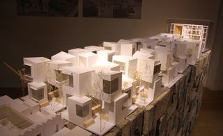 Architectural model displaying the cube rooms and modular housing