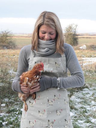 Woman holding a pet chicken