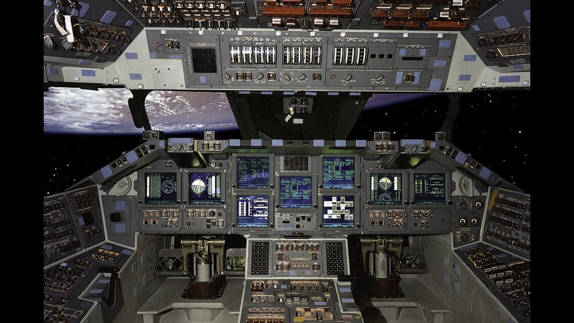 An image of a cockpit with a glass window looking out into space.