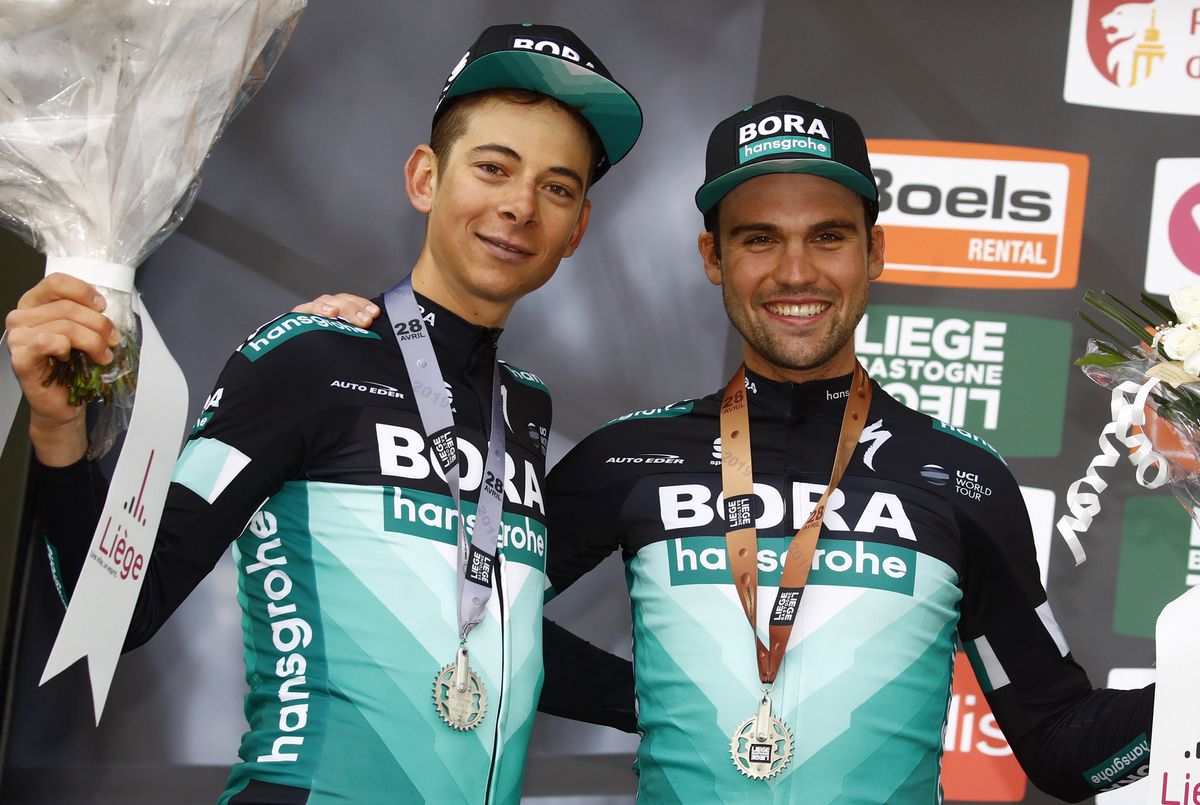 The two Bora-Hansgrohe men celebrate on the podium together