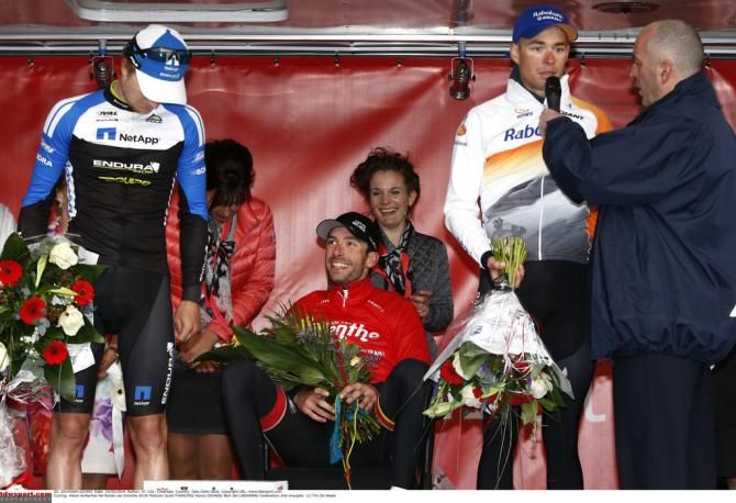 Kenny Dehaes takes a seat on the podium