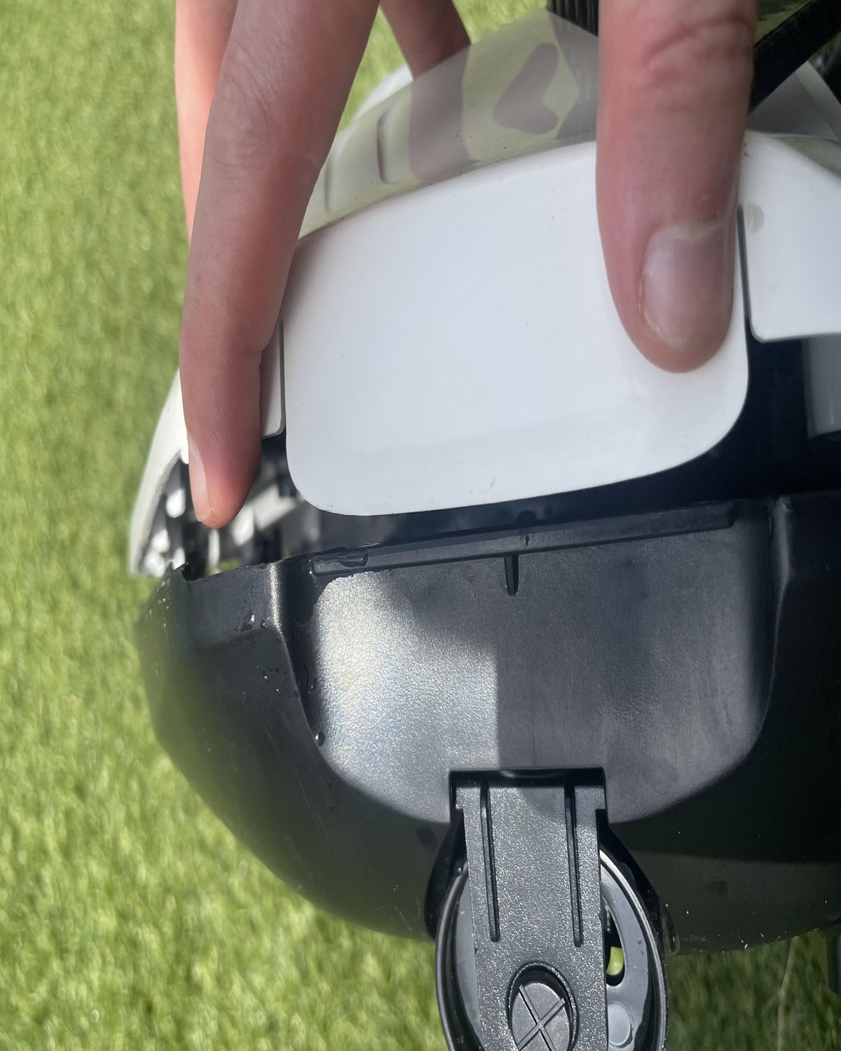 A robot pool cleaner being opened