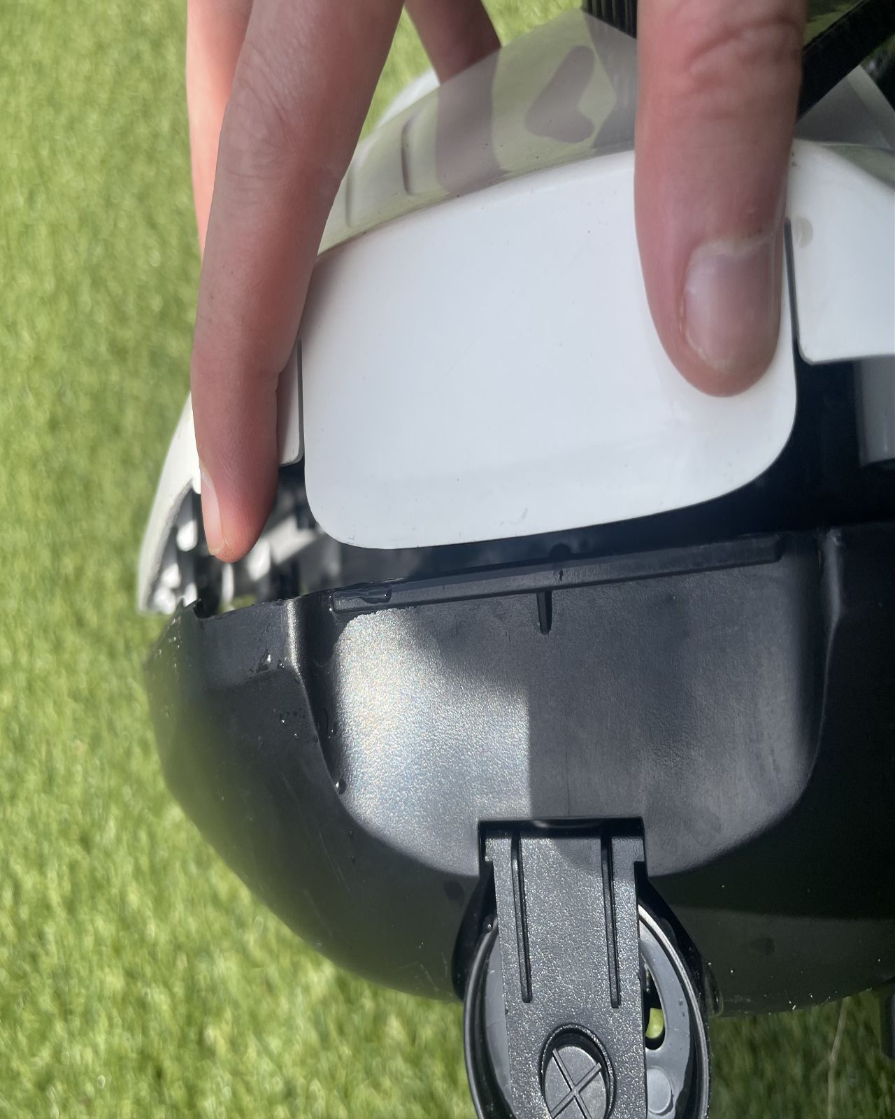 A robot pool cleaner being opened