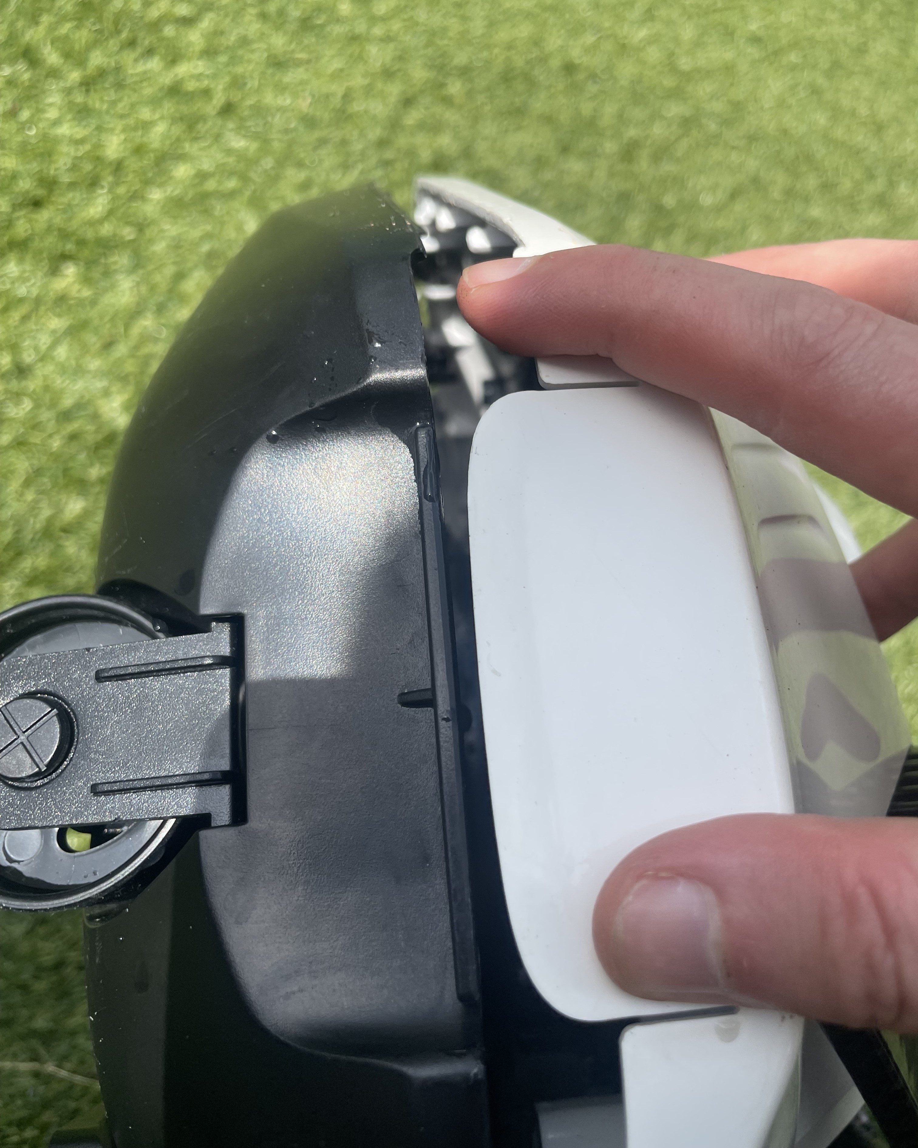A robot pool cleaner being opened