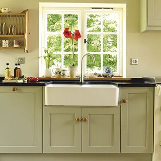 kitchen with sink unit and french window