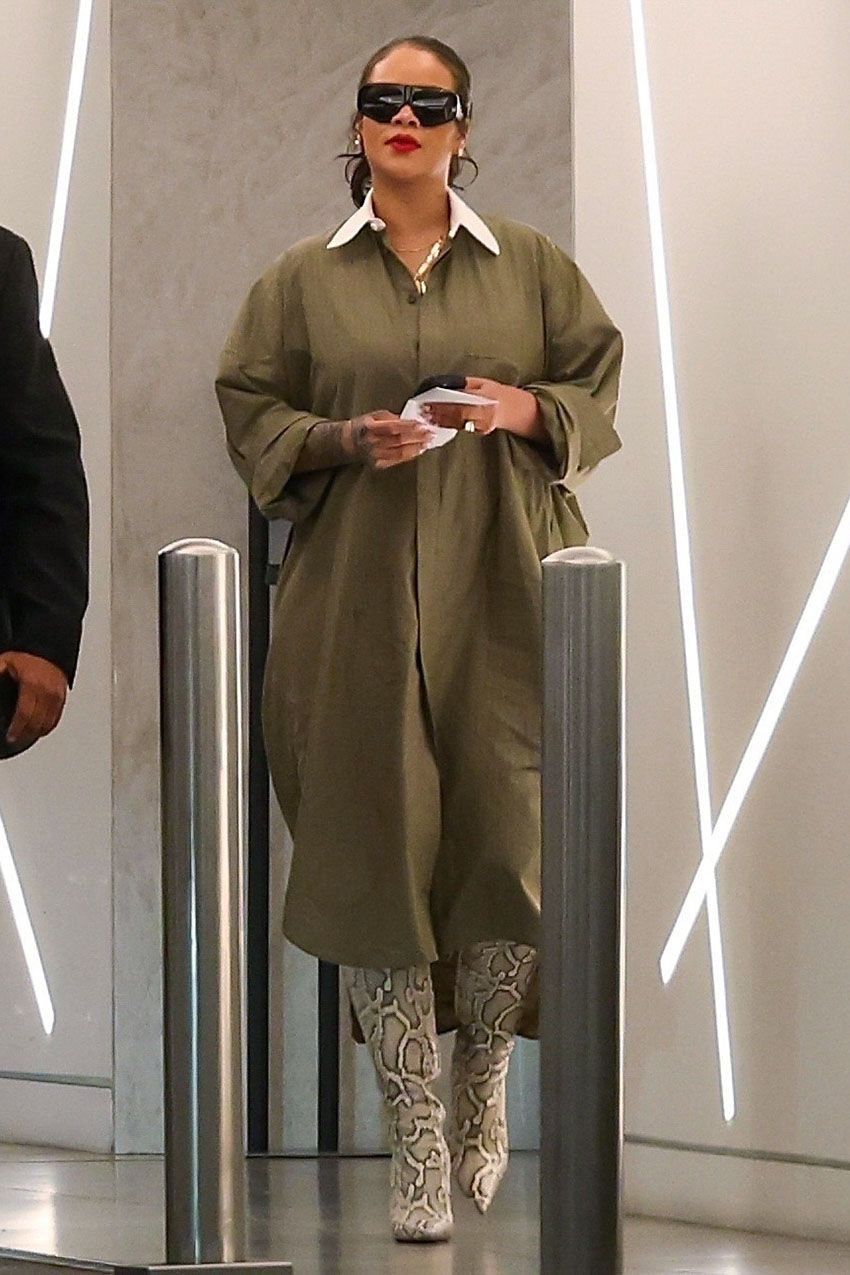 Rihanna wearing a green shirt dress and snakeskin boots