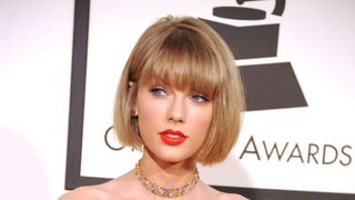 taylor swift on the red carpet with a box bob haircut