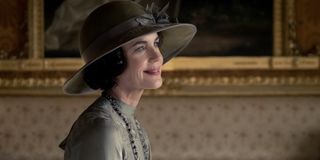 Downton Abbey Cora smiling, wearing a hat, in a room for tea