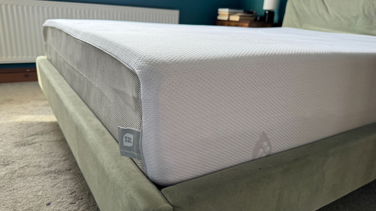 Corner view of the ErgoFlex 5G mattress on our tester's bed frame